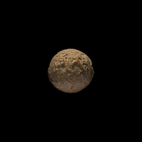 Figure 4: 5500-4500 BC. A sealed spherical clay bulla envelope, containing clay tokens which can be heard rattling inside